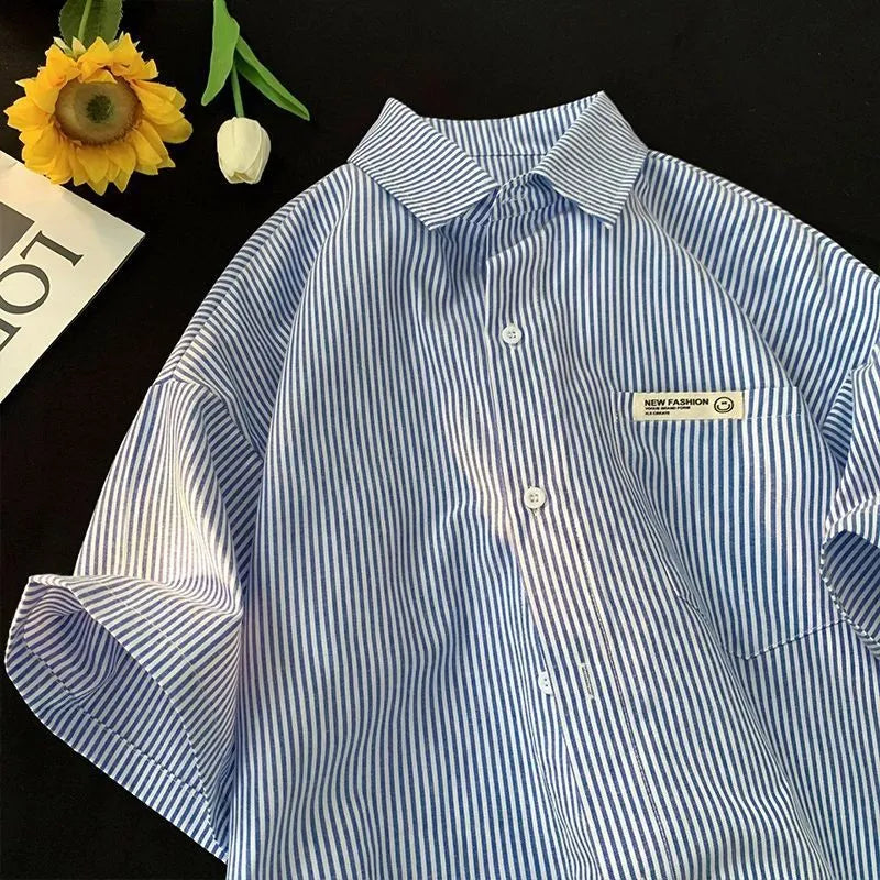 Blue striped loose-fit plus size shirt with half sleeves on hanger