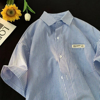 Blue striped loose-fit plus size shirt with half sleeves on hanger