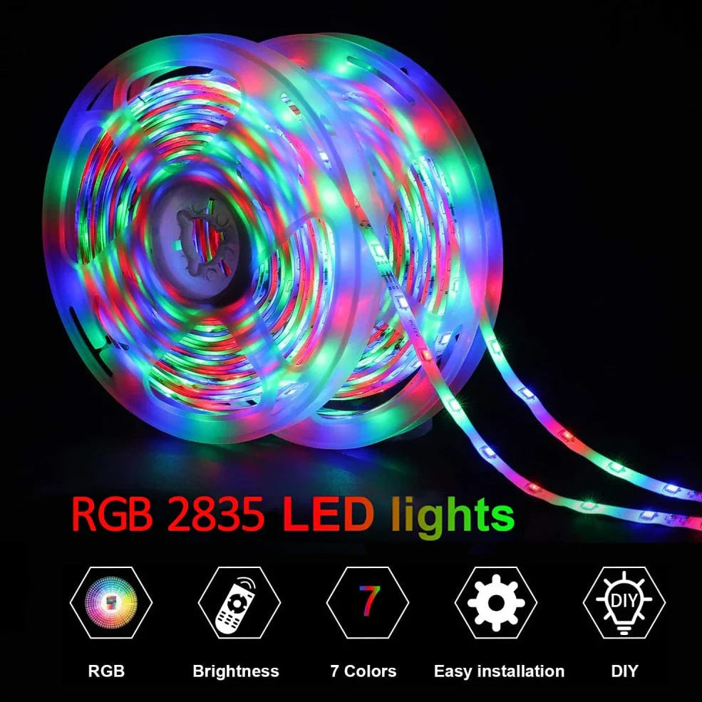 Flexible RGB LED strip lights with Bluetooth control showing colour changing effects on TV backlighting installation