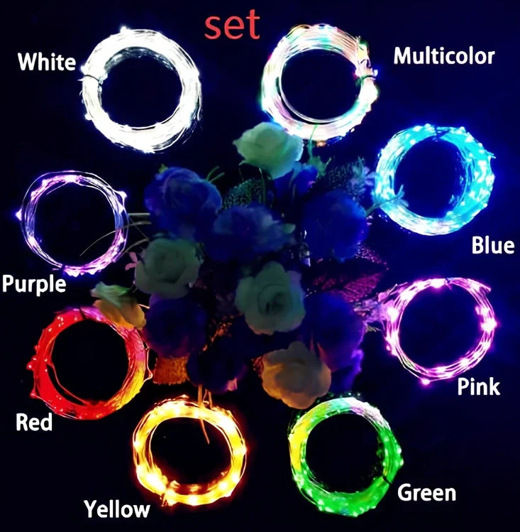 Copper wire LED string lights wrapped around wine bottle with 20 white LEDs illuminated