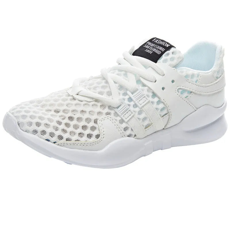 Low-top casual sneaker in mesh with hollow-out design and round toe.