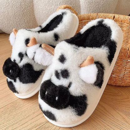 Cartoon cow plush slippers in black, leather red, and brown with non-slip soles