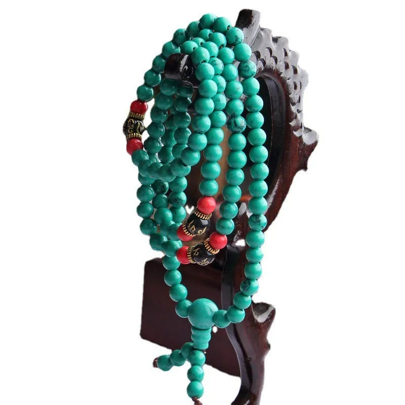 Turquoise Tibetan 108 beads bracelet with synthetic stone powder construction