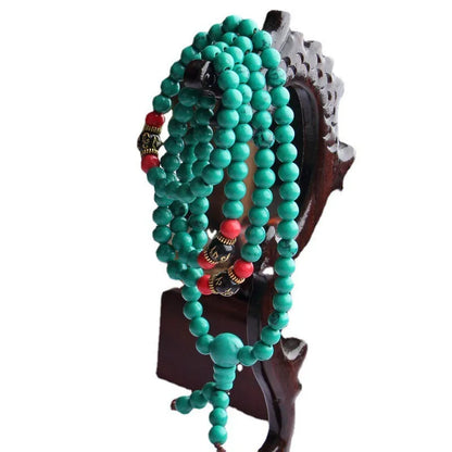 Turquoise Tibetan 108 beads bracelet with synthetic stone powder construction