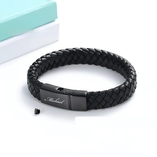 Black leather and stainless steel men's casket bracelet with engraved letters in a woven design.