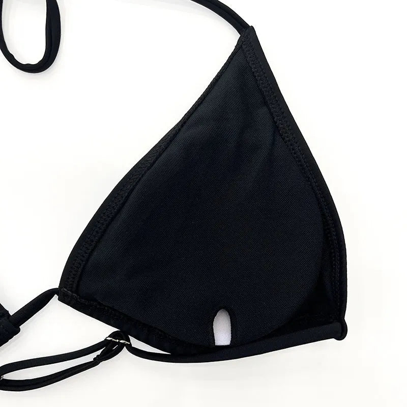 Black mesh long sleeve women's bikini four-piece swimsuit set on a white background.