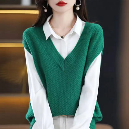 Women's creamy-white sleeveless knit vest with a raised 3D pattern, shown on a hanger.