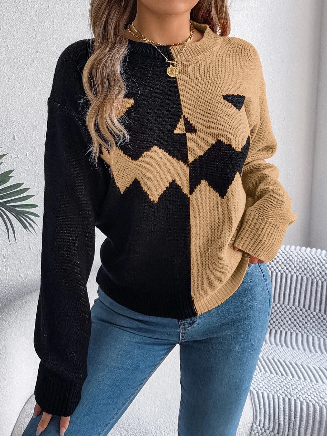 Cozy Halloween pullover sweater with ghost pattern in orange, khaki, and grey colors