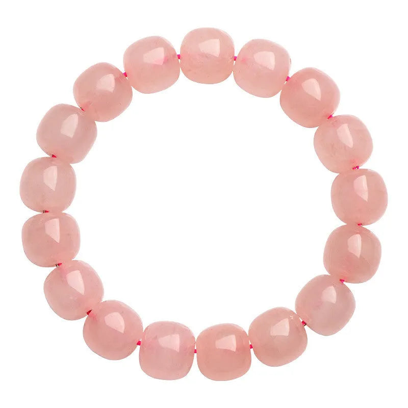 Natural crystal barrel shaped bead bracelet with 19 pink 8-10mm polished crystal beads in geometric pattern