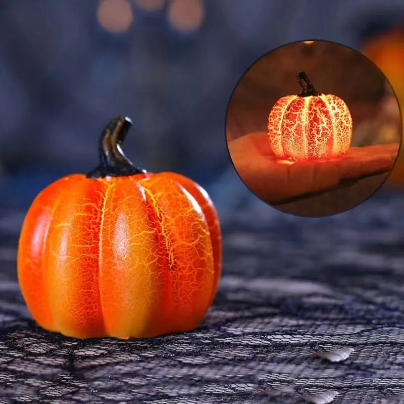 Set of three resin Halloween pumpkin lanterns with LED lights in long, medium, and short sizes.