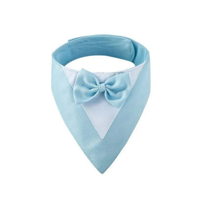 Triangle-shaped pet bib scarf with a bow, shown in a bright colour, displaying the soft fabric and absorbent towelling lining.