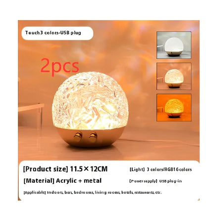 Spherical water ripple projector night light with touch controls creating colourful aurora patterns on wall