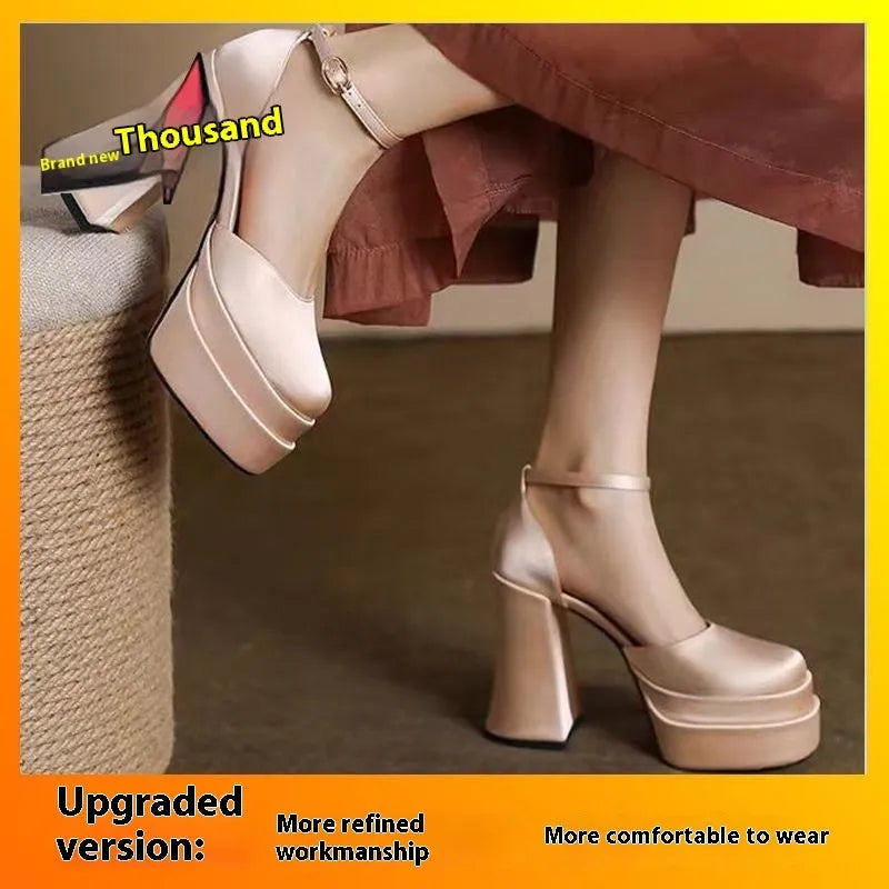 Women's white chunky heel platform pumps with a round toe and mid-calf cut.