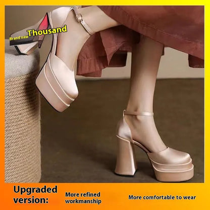 Women's white chunky heel platform pumps with a round toe and mid-calf cut.