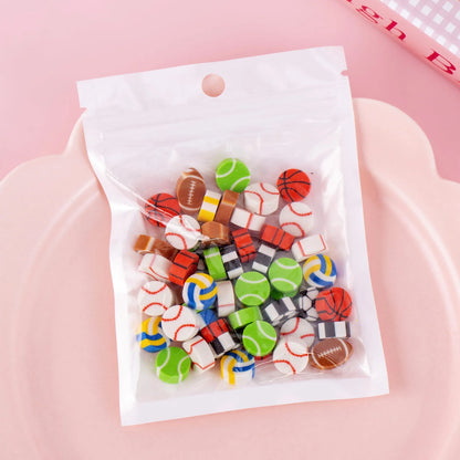 Assortment of 50 small cartoon erasers in pearlescent bags, showing fruit, animal, and holiday designs.