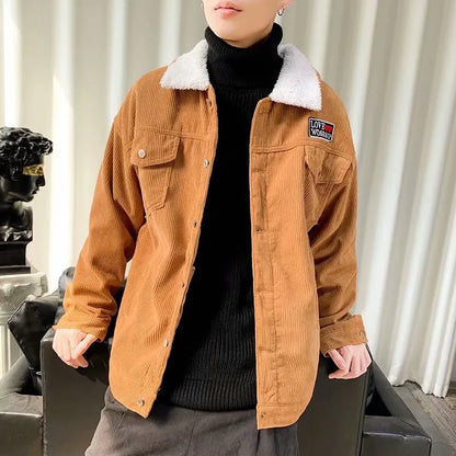 Men's loose fit corduroy work jacket in khaki on a hanger.