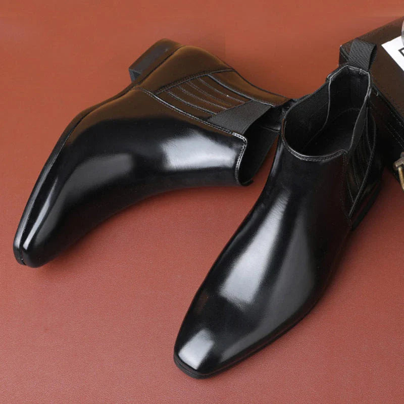 Sleek Chelsea-style boots for men with pointed toe and square heel, available in black and brown colors