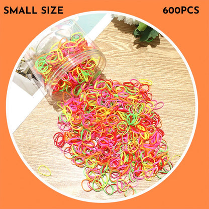 Multicoloured assortment of thin TPU elastic hair bands for babies and children in a reusable plastic container.
