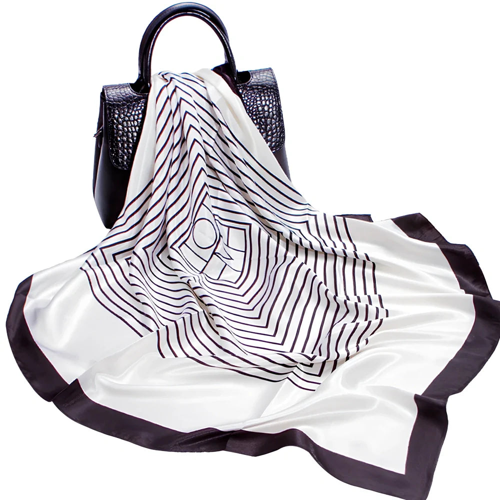 Square silk scarf with satin weave showing carriage chain pattern, measuring 90cm by 90cm