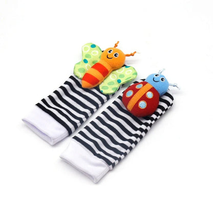 Four fabric baby socks with cartoon designs and ringing feature for infant training