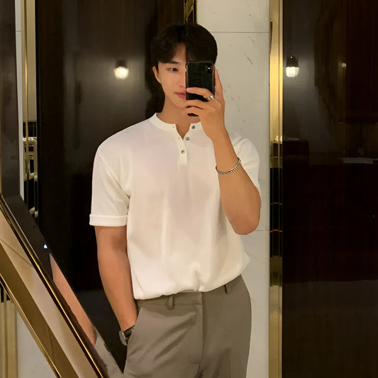 Men's slim-fit black ice silk knitted short-sleeve shirt laid flat.