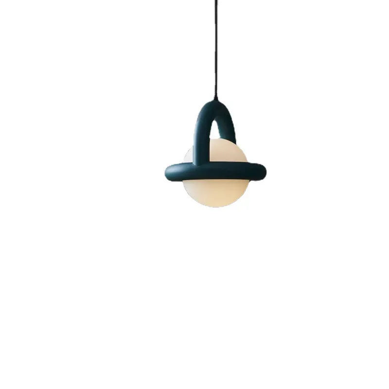 Danish designer hanging line lamp with adjustable cord and matte finish in bedside setting