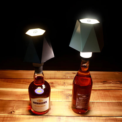 Wireless wine bottle lamp with USB charging cable in black aluminium finish showing LED illumination