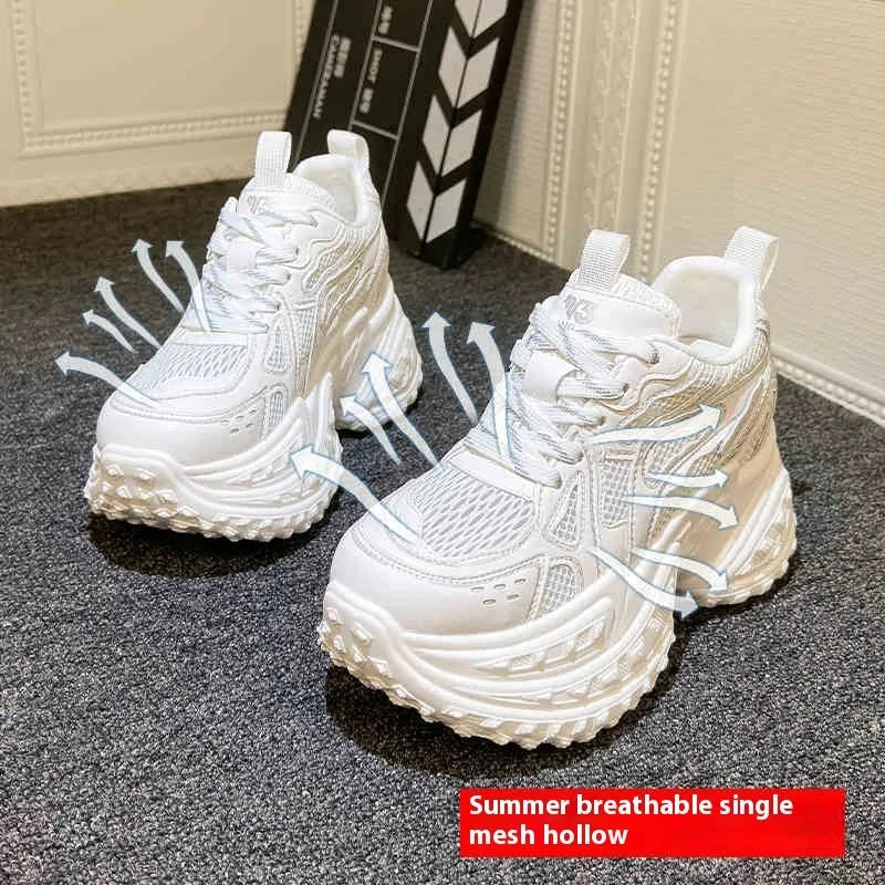 Women's white height increasing shoes with lace-up design and round toe, showing internal insole construction