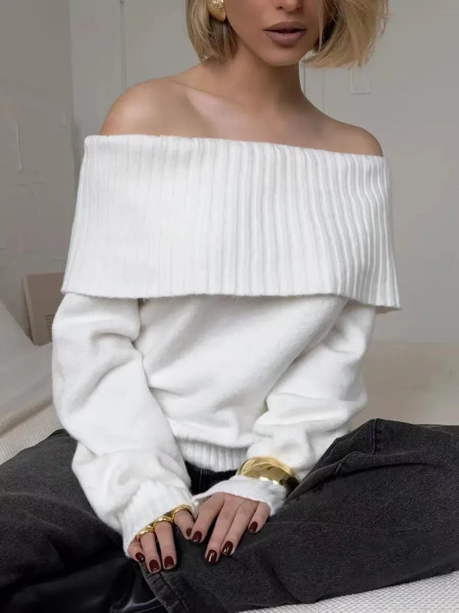 Grey off-shoulder acrylic sweater with 3D pattern texture, showing strapless design and regular sleeves