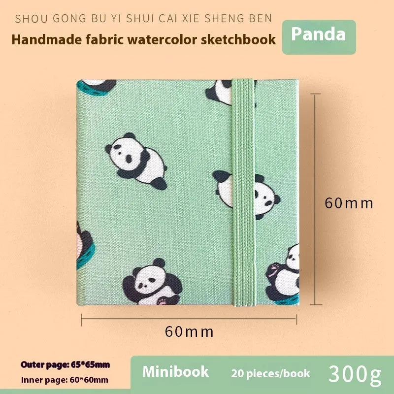 Feiluniao watercolour notebook with fabric cover, 185mm length, open to show paper for painting.