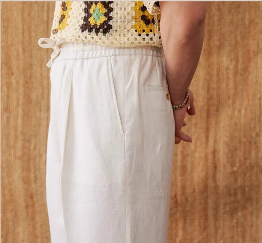 Linen high-waisted trousers with an elasticated waistband and loose straight-leg cut in greige colour