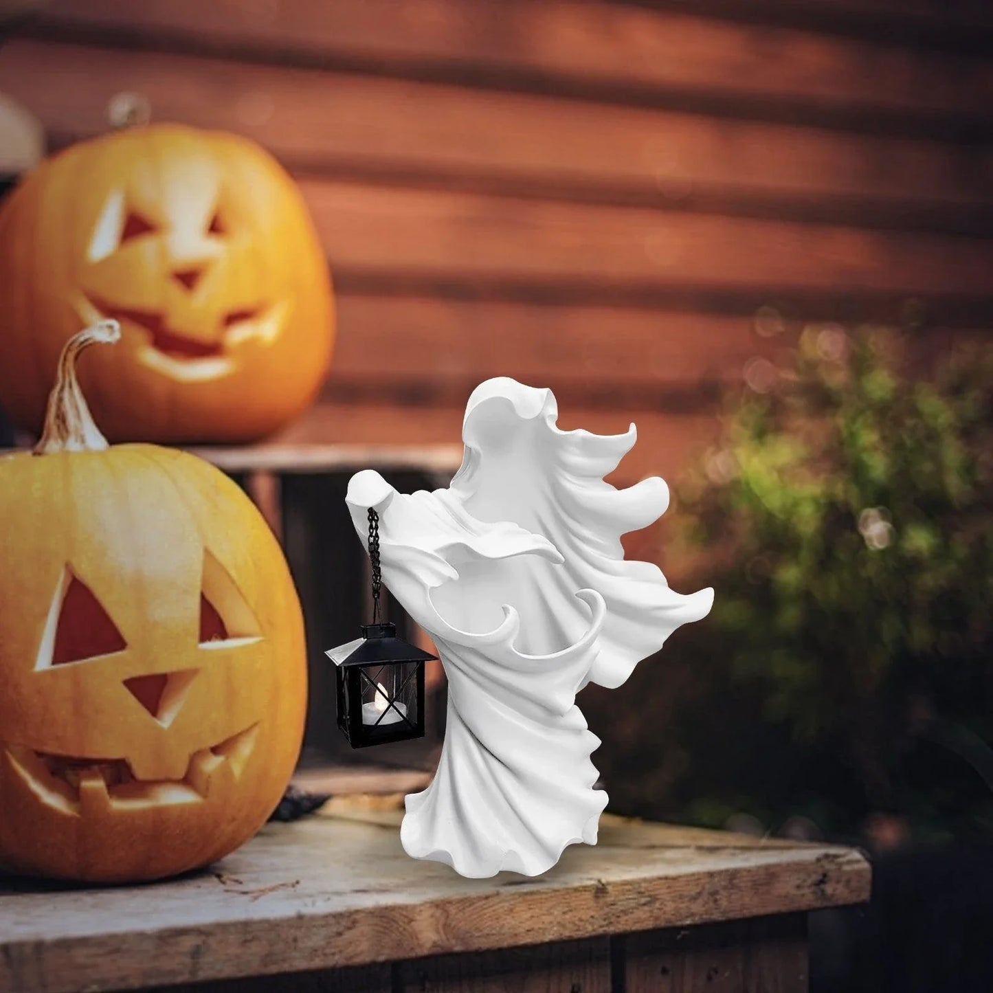 Faceless ghost sculpture in resin, a unique Halloween decoration with a spooky, supernatural design