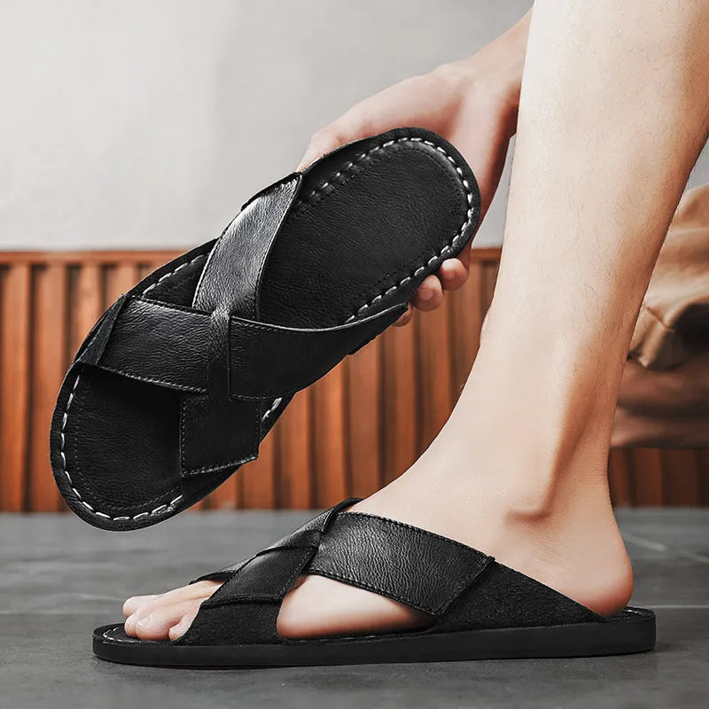 Men's black genuine leather slip-on sandals with rubber sole on a neutral background.