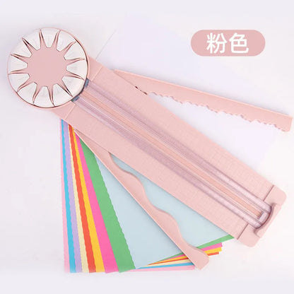 Pink 12-in-1 paper cutter with dotted guides measuring 46.2cm length on craft table