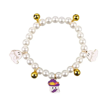 Halloween cat collar with simulated pearls and pumpkin-shaped charms in purple ghost, skull, and smiling designs.