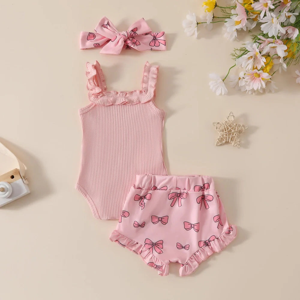 Girls' pink cotton romper and shorts two-piece set with included hair accessory