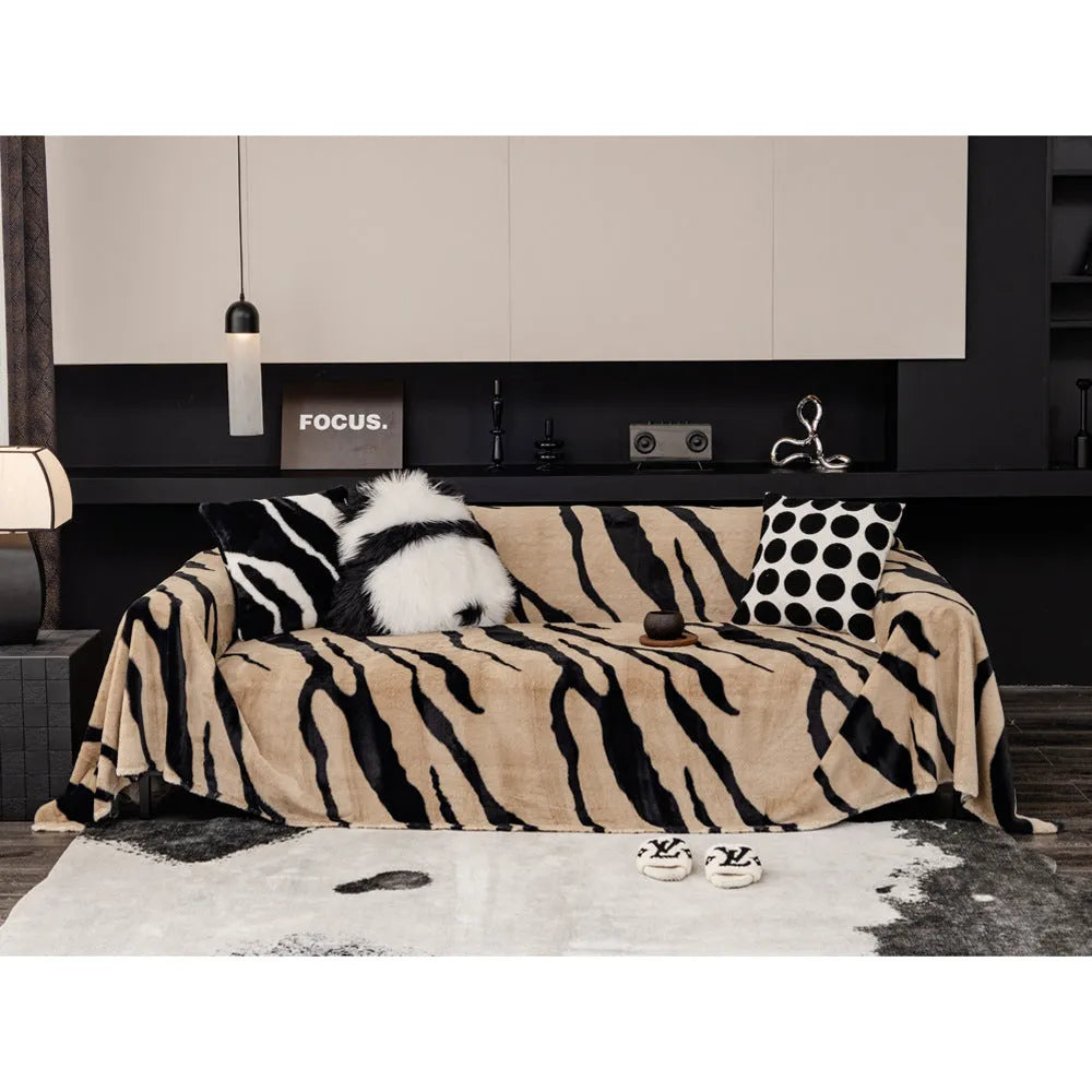 Zebra pattern sofa cover cloth in flannel fabric with non-slip backing, shown in caramel colour on a sofa
