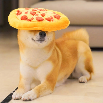 Bright yellow squeaky dog toy shaped like a pizza slice with a soft teddy fabric surface
