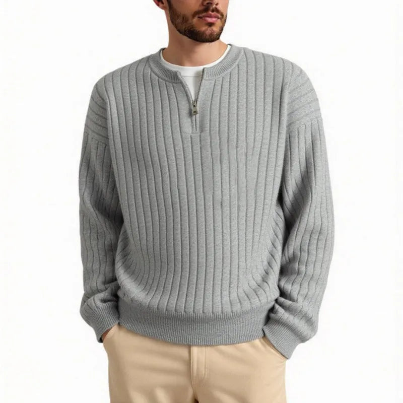 Men's grey half-zip pullover sweater with textured knit and loose fit, showing front view with zip partly open.