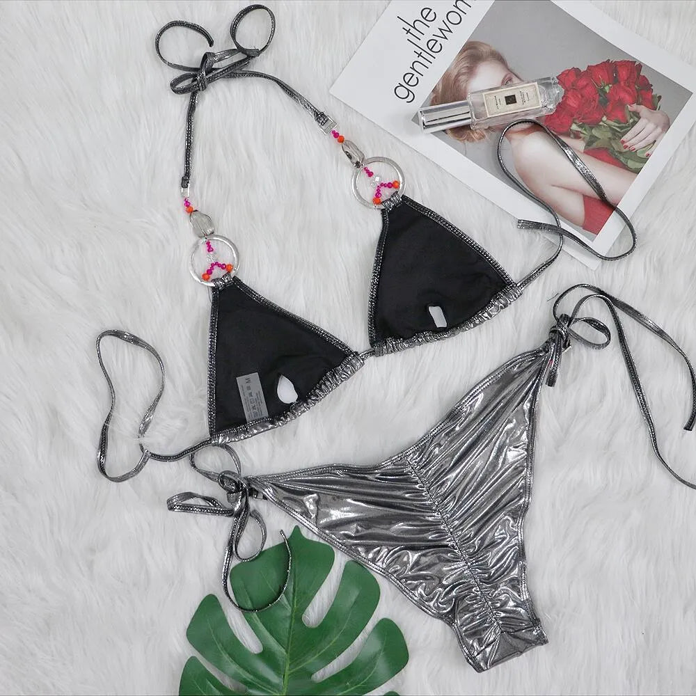 Silver women's bikini set with split-side briefs on mannequin
