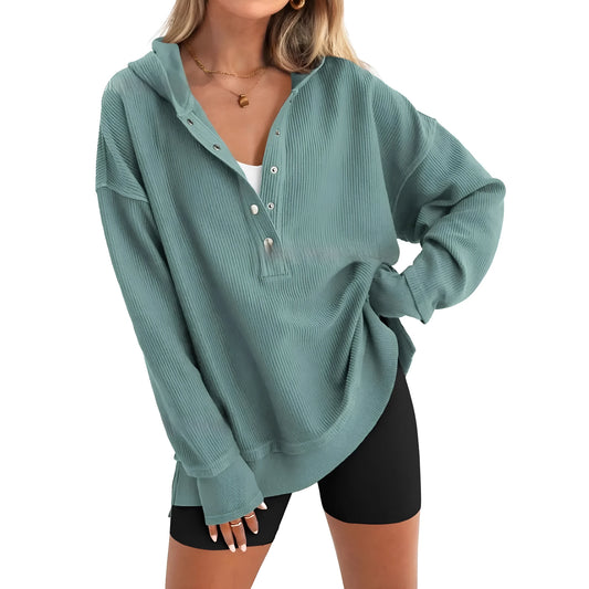 Women's loose raglan sleeve sweater in peacock green colour, showing long sleeves and casual pullover style