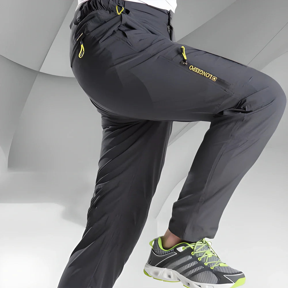 Versatile stretchable cargo pants for men with reinforced stitching, water-repellent properties, and convenient zipper pockets for outdoor adventures