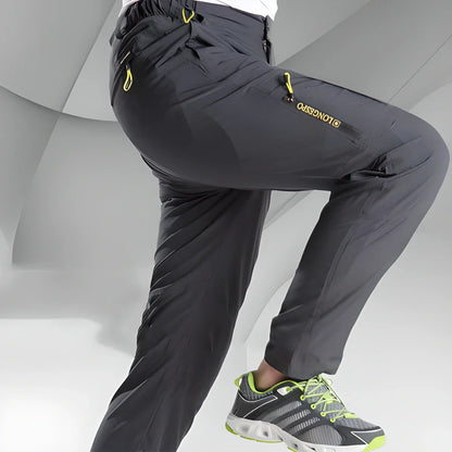 Versatile stretchable cargo pants for men with reinforced stitching, water-repellent properties, and convenient zipper pockets for outdoor adventures