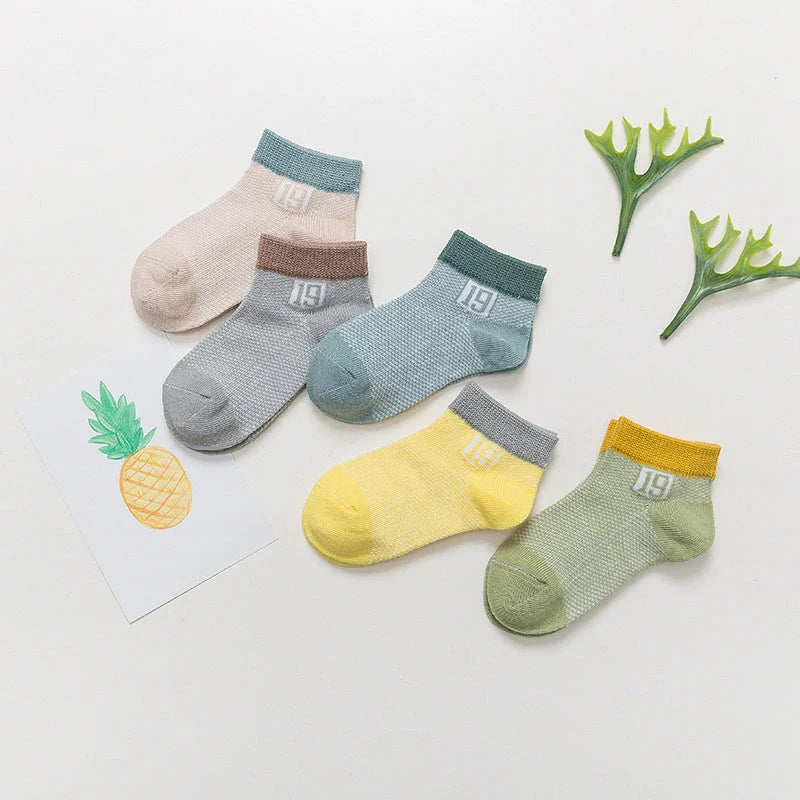 Premium cotton baby socks in various vibrant colors and sizes for boys and girls
