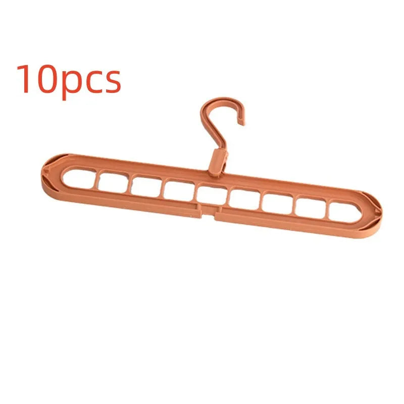 Green nine-hole folding hanger with trousers organised across nine hanging points, showing 45cm width