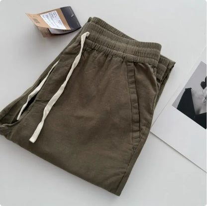 Men's loose straight casual pants with drawstring waist in navy blue colour, showing relaxed fit and straight leg design