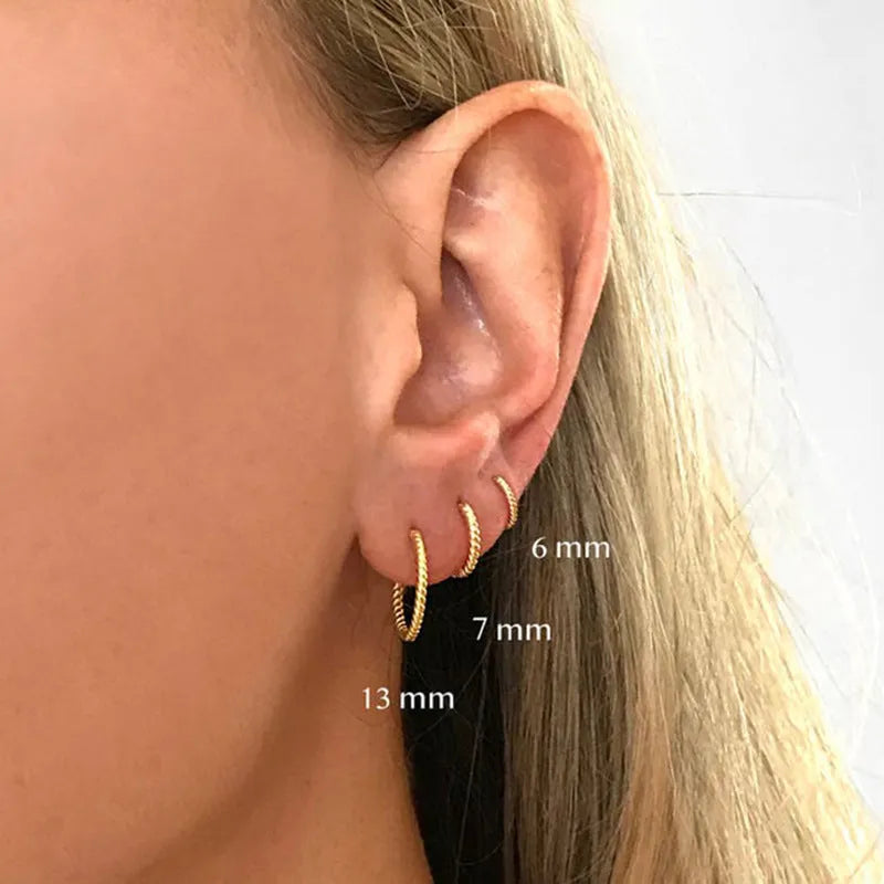 Sterling silver twisted string round ring earrings in gold or platinum colour.