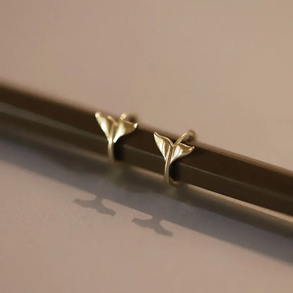 Pair of S925 sterling silver fishtail earrings with 14k gold plating in gold colour.