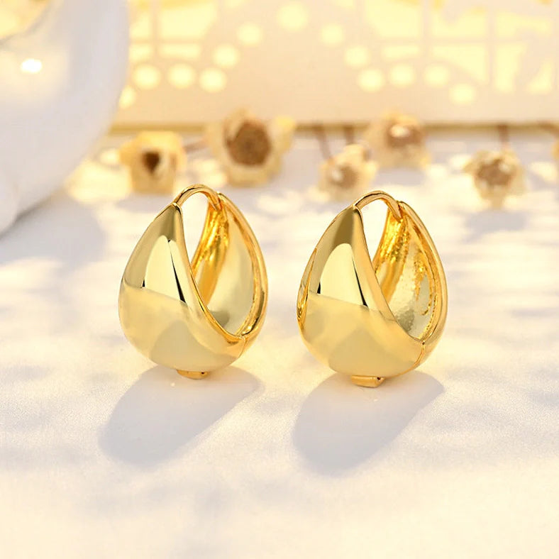 Women's geometric circle earrings with gold inlay treatment and water drop ear clip design