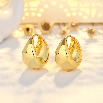 Women's geometric circle earrings with gold inlay treatment and water drop ear clip design